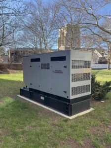 Costs of Power Outages: Backup generator powering a business during an outage, helping prevent operational disruptions.