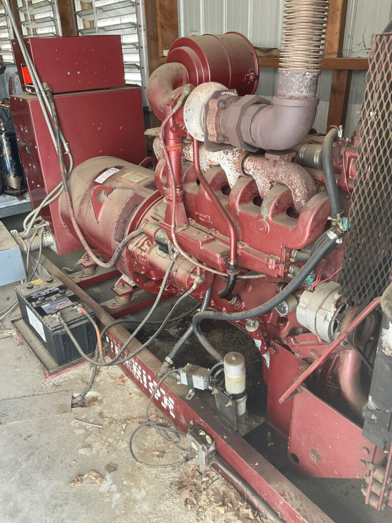 A commercial back up generator covered in dust, dirt, and grime.  This can potentially damaging sensitive components and accelerating the formation of rust.