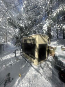 Generator Ready During a Snowstorm for any power outages. Snow has been cleared from around and on the generator for safety and easy access.