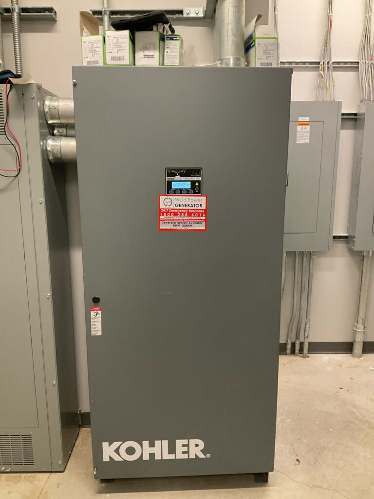 A close-up image of a Kohler transfer switch, showcasing its control panel. The transfer switch is installed at in a skyscraper in New York City, ensuring proper power transfer during an outage."