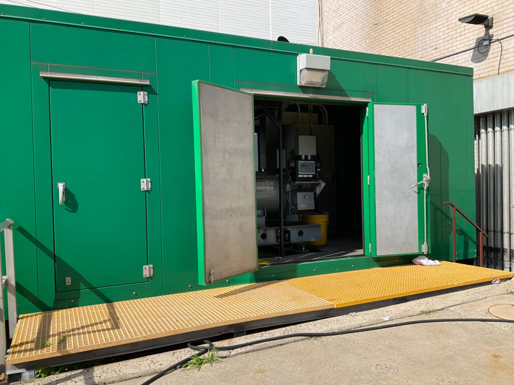 Large generator with a walk in enclosure that provides Backup power in Healthcare facility in Massachusetts