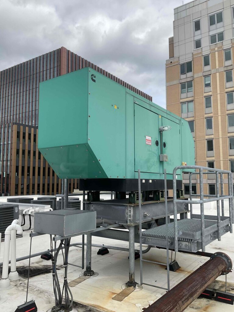 Cummins generator mounted outside on the roof of an office building in Boston, MA.