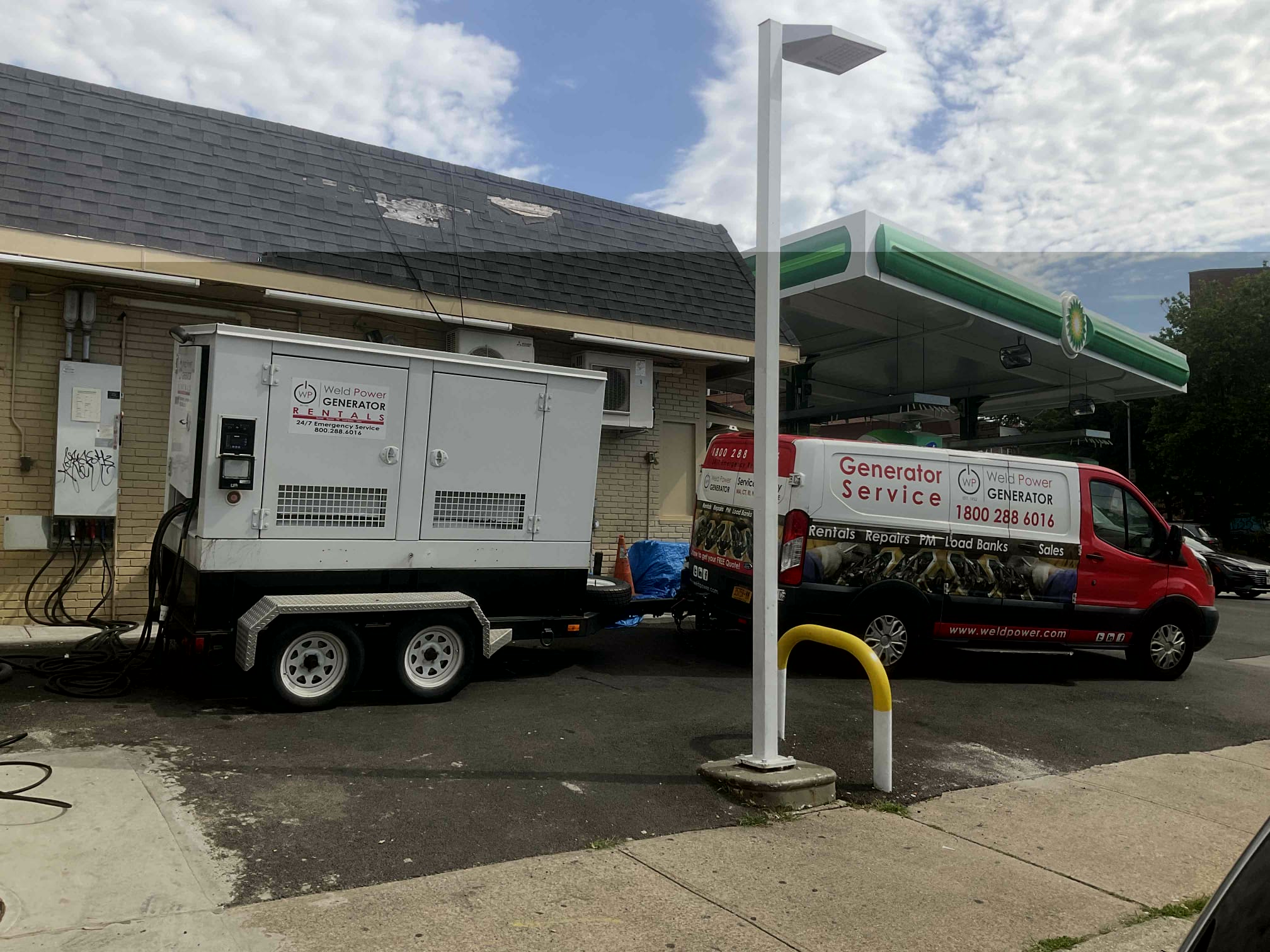 Weld Power Generator Service van towing a Weld Power Rental Generator to a gas station that was experiencing an extended power outage.