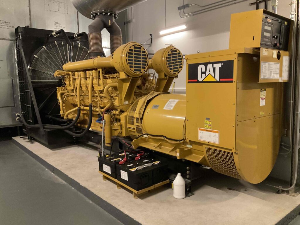 Caterpillar commercial generator with exhaust system going up into the ceiling. 