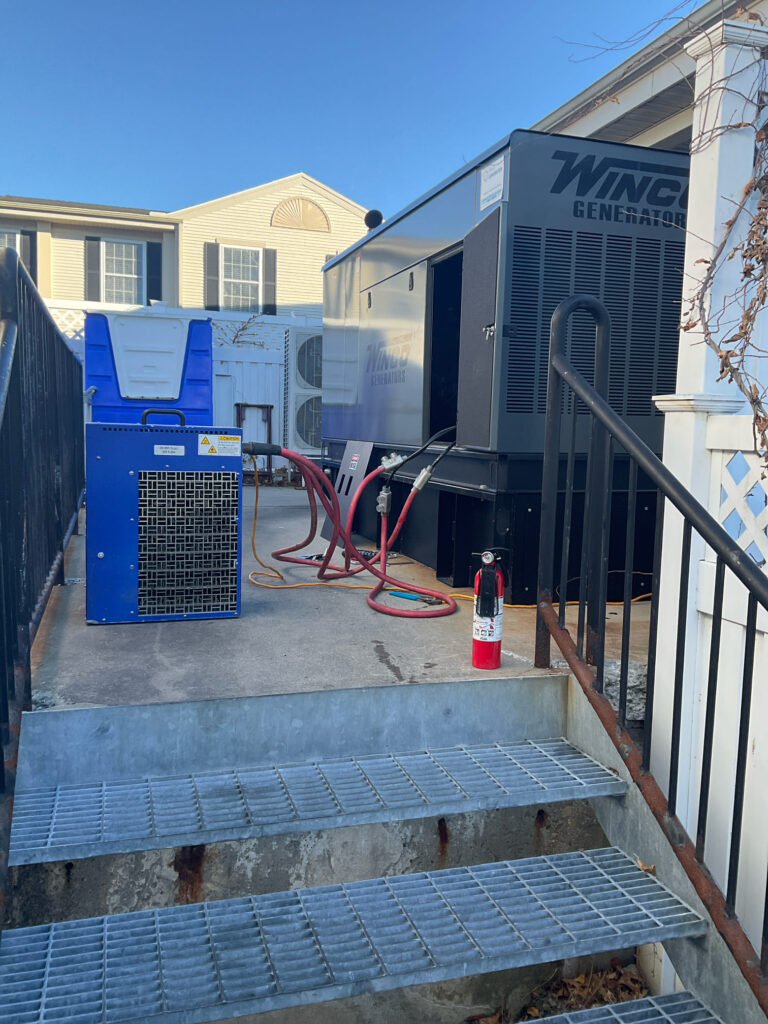 Suitcase load bank units with cables running to a Winco Generator to complete Triennial load bank testing for a assisted living facility in CT.