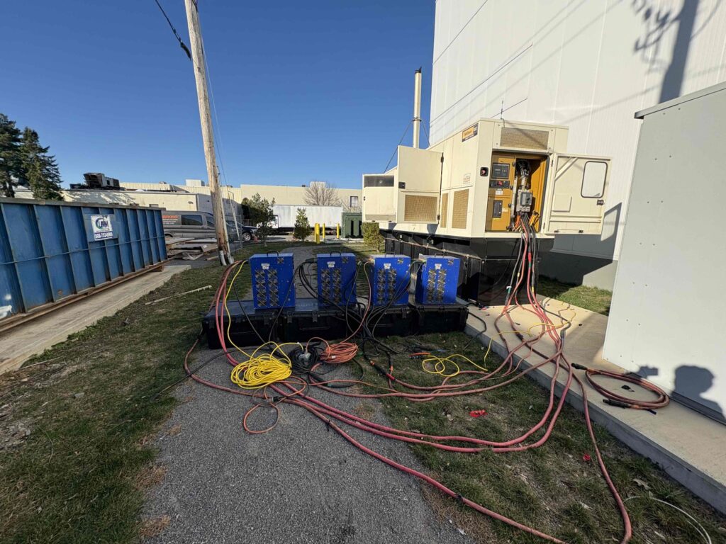 4 suitcase load banks connected to perform 4-hour load bank testing on a 350 kW CAT generator for a warehouse in NJ.